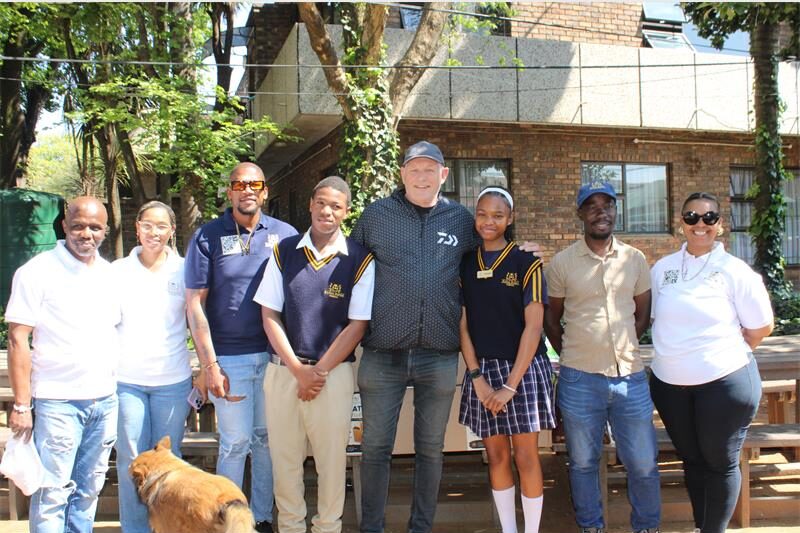 Learners and staff spent time playing with children and sharing lunch after donating non-perishable goods collected over several weeks.
