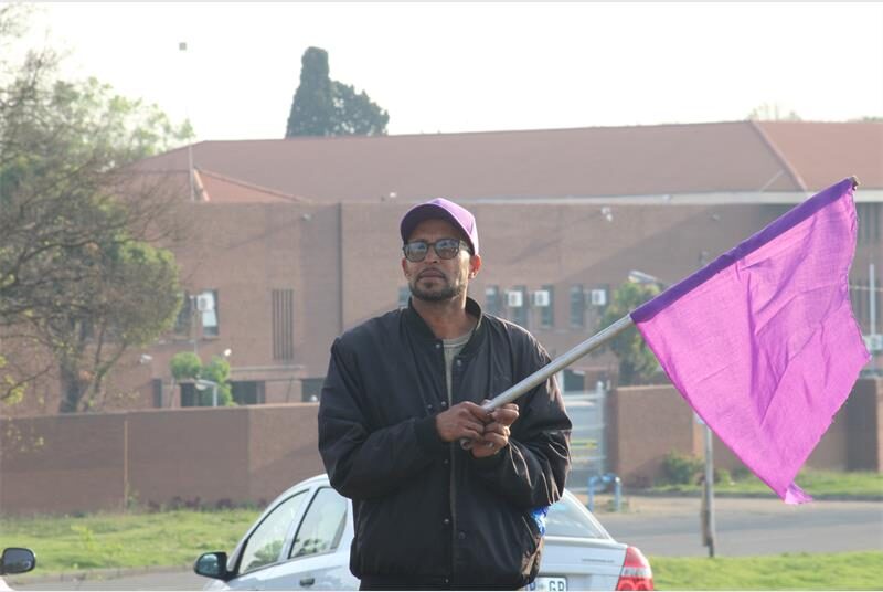 Local community groups joined forces at a busy intersection to remember victims of gender-based violence and demand faster action from law enforcement.