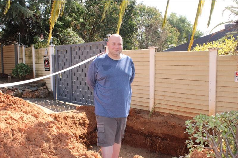 A Cockspur Road resident is relieved a burst water pipe has been repaired, but says workers dumped pavers into the hole and left his driveway incomplete.