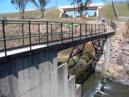 Mr Leon Baben and Modderfontein Conservation Society’s chairperson, Ms Ellen van Dongen, approach Baben Bridge, a robust construction over the Modderfontein Spruit.