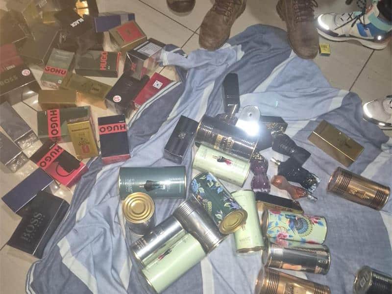 The arrested robber was found with perfumes matching those stolen from the shop.