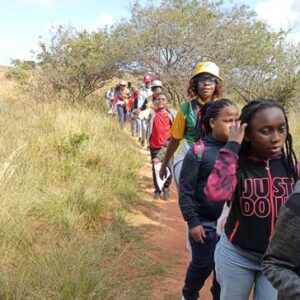 Over 75 young Pathfinders from the Berea Seventh Day Adventist Church visited Melville Koppies for a day of hiking, map reading, and learning about local heritage—an experience that left many eager to return with their families.