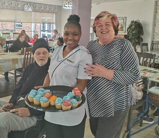 Residents of Thembalami Care Centre and MODA enjoyed a lively visit from Arwyp Training Institute, complete with music, cupcakes, scarves, and dancing.