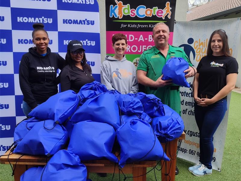 Komatsu, CGU and KidsCare came together on Mandela Day to bring comfort to young trauma victims—one teddy bear at a time.