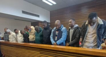The 10 accused SAPS and EMPD officers in the dock in Court D at the Germiston Magistrates’ Court. Photo: Stephan Lehman.