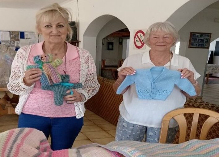 The Leisure View Village knitting group in Edenvale has spent 15 years creating baby packs and clothing for the elderly, supporting hospitals, homes, and charities across South Africa.