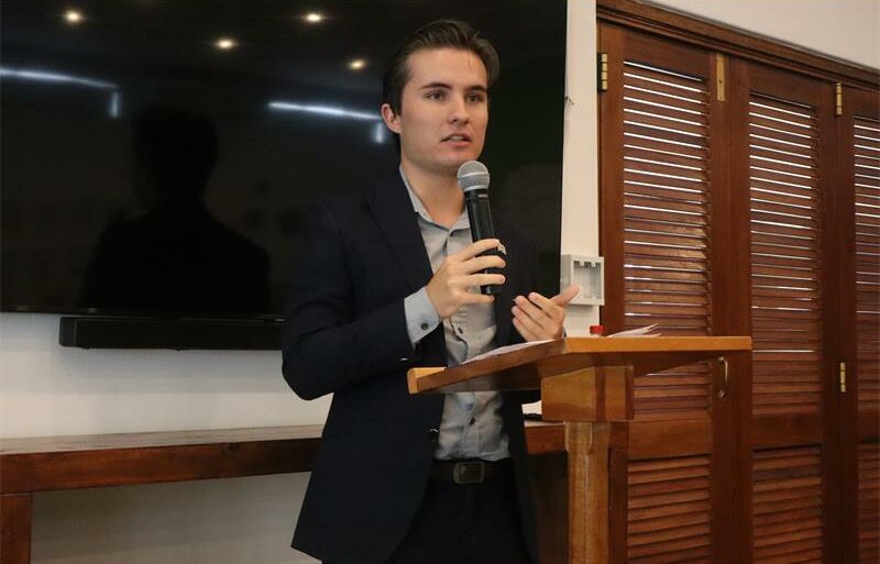 Guest speaker Christopher Walker cautioned that artificial intelligence-driven misinformation is already shaping elections, markets and reputations, urging greater awareness and responsible use of the technology.