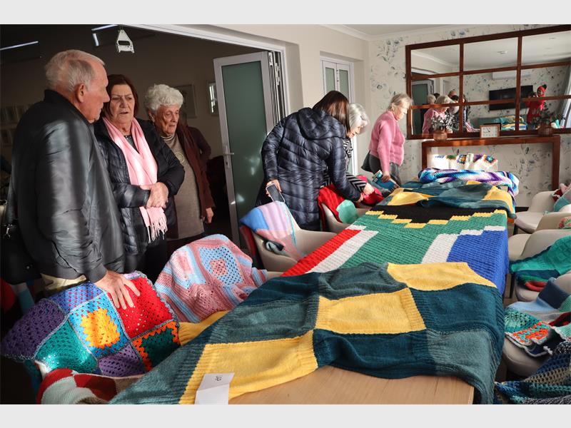 Residents, families and friends joined forces to create 111 blankets for the 67 Blankets for Mandela Day initiative, celebrating compassion and community spirit.