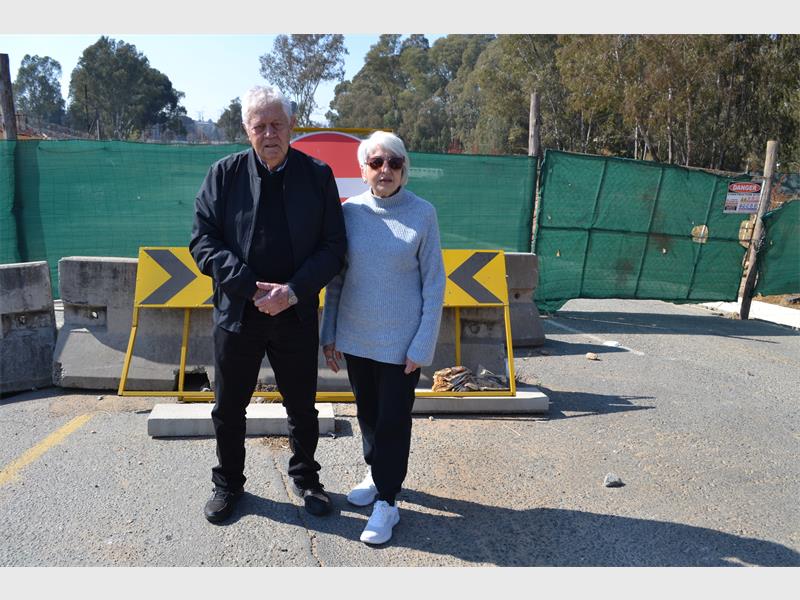 Long-running construction delays at the Modderfontein Road Bridge are causing severe traffic congestion and financial losses for nearby businesses, with residents frustrated by the lack of progress.