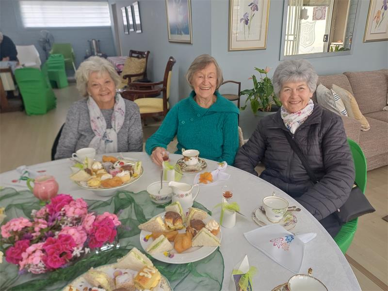 Quondam Village residents relax, chat and savour delicious treats at Woman’s Day high tea organised by the entertainment committee.