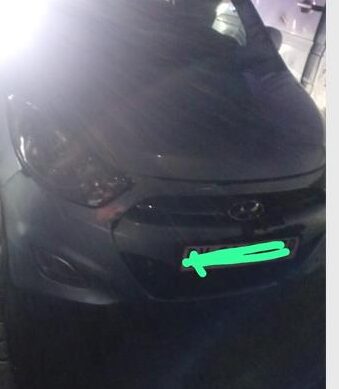 Specialist officers retrieve a silver hatchback abandoned at Modderfontein intersection.
