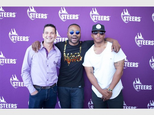 GIVING BACK: Steers marketing executive, Adolf Fourie; rappers Sizwe 'Reason' Moeketsi and Gcina 'DotCom' Nkula at the Shout burger launch.