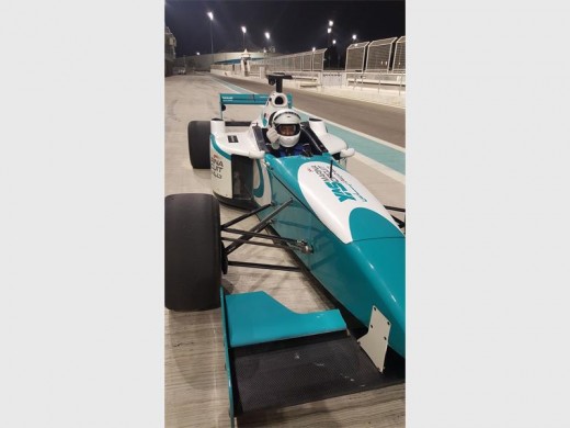 The general manager of Montecasino, Glenn Joseph, drives the Formula 1 car at Abu Dhabi's Ferrari World.
