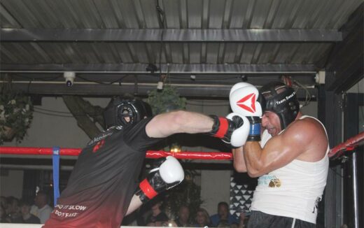 Johnny Anthony (right) blocks a punch from his opponent
