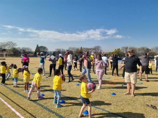 Parents play with their kids on sports day.
