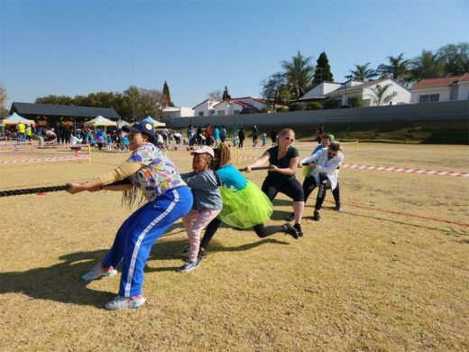 Parents together with learners pull together at the sports fun day.