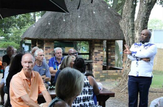 Solly Msimanga addresses residents about their plans to resolve the squatter camps in Lonehill.