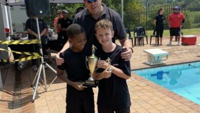 Kgosi Mocoenyane and Finley Niven with their school principal Gordon Ewen.