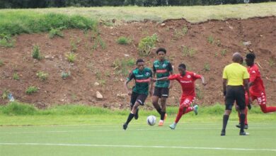 Luyanda Ngcobo from Transition Football ups his game as he drives past a Highlands Park player.
