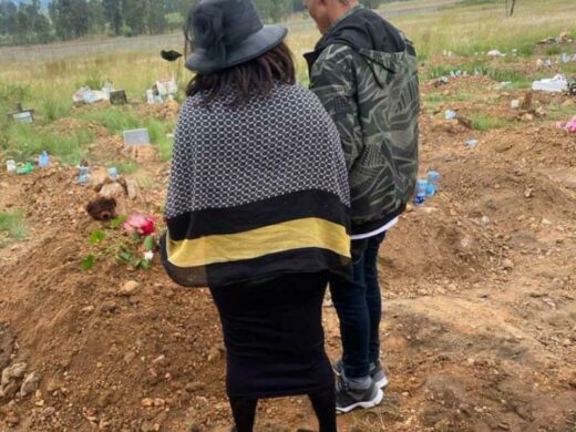 Family at the final resting place of Owaratwa Chabide.