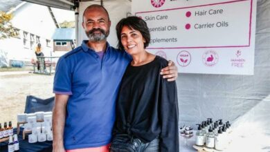 Her brother supporting her at one of her markets. Glynn Isaacs and Leigh-Ann Harris.