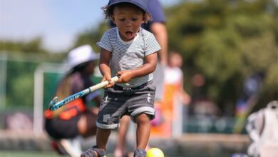 Milan Seerane is on the hockey field having fun.