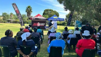 Domestic workers sit as they get schooled.