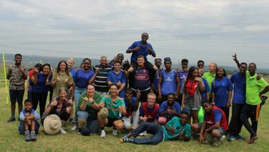 The learners played with their teachers on the field.