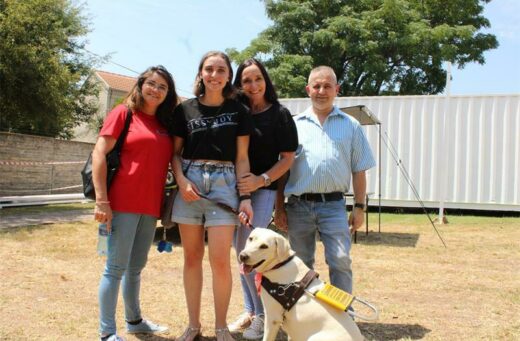 Adelina Teixeira with the Pita family, Jessica, Puala, Fudge and Daniel.