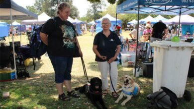 Jeanette Barnard and Fern with their puppy raiser Madelon Green.