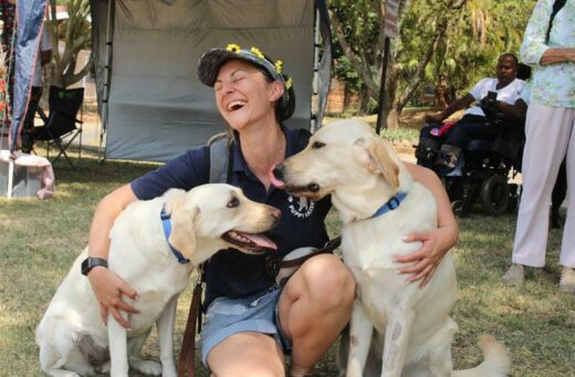 Minette van der Walt is a puppy raiser and she is with Kloe and Thor.