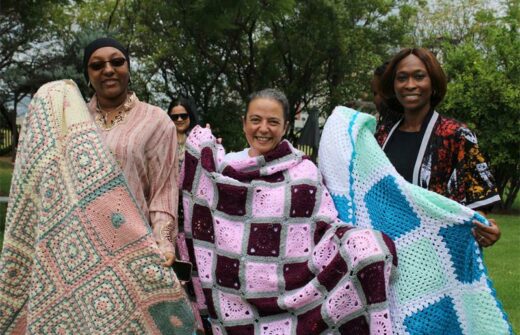 Mairama Hamidou, Carla Guedes and Titi Olowoniyi show their recently completed blankets.