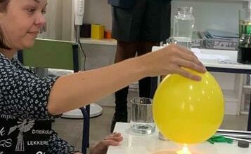 Teacher Marli Olivier while Fezile Zwane watches the experiment.