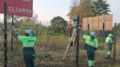 The Green Team is replacing the fence after It was stolen.