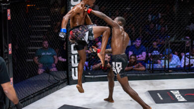 Nathanial Komana executes a flying knee on Eduardo Barros.