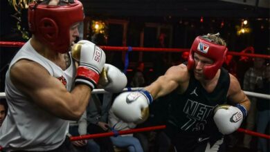 Jean Botes and Greig Walker trade blows.