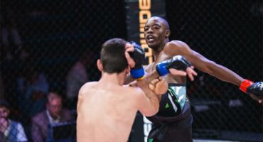 Tebatso Molele throws a headkick against Willie van Rooyen.