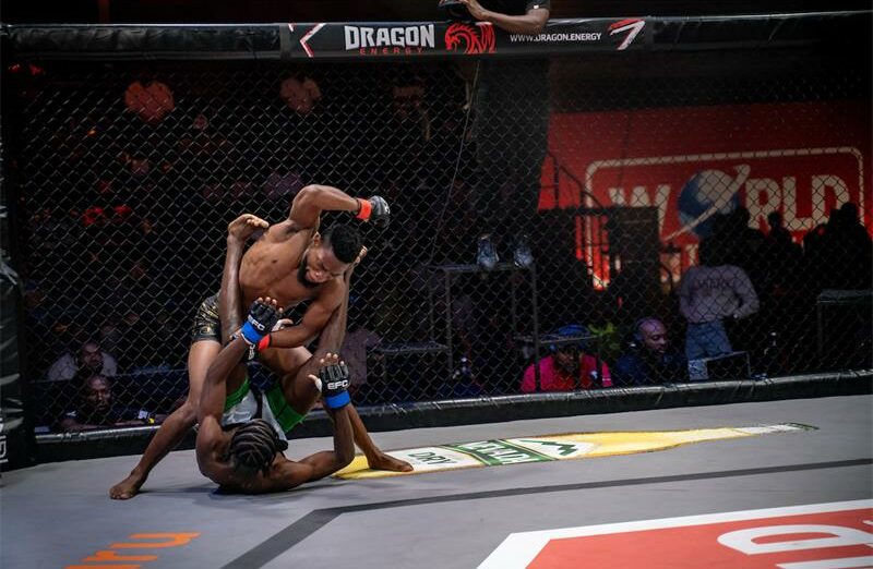 Kgaugelo Moitshela throws a hammer fist against downed Edson Machavane.