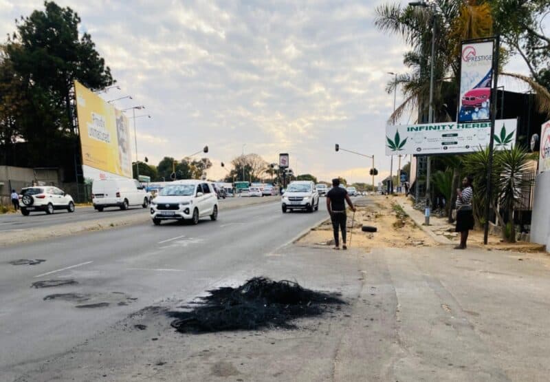 Frustrated Clay Oven informal settlement residents accuse authorities of failing to act after a man lay bleeding for hours without help.