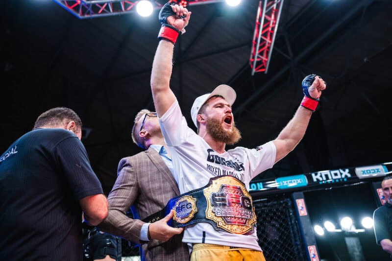 Billy Oosthuizen survives a brutal war to claim the interim featherweight crown in a controversial disqualification finish at EFC 128.