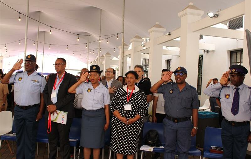 Department of education and SAPS officials salute to the national anthem during the formal pledge signing ceremony between the Department of Education, SAPS, and leaners at Henley Business School on October 15, 2025. Photo: Ayanda Ntshingila