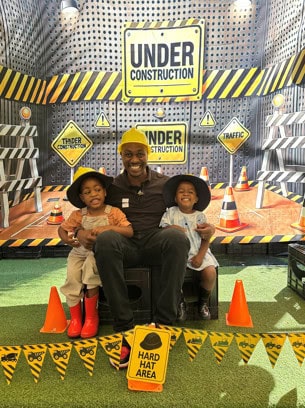 Fathers and little ones share laughter, love, and a picnic at Rainbow Babies and Kids’ father/child day.