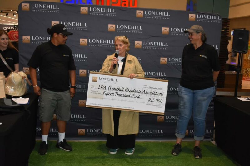 Lonehill Resident Association team receive the R15 000 donation raised from the Lonehill Triple Mile fundraiser at Lonehill Shopping Centre in October 18, 2025. Photo: Supplied