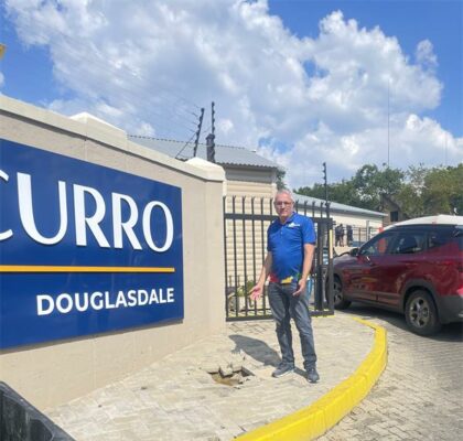 Chris Santana urges repairs to pavement damaged by water leak near Curro Douglasdale. Photo: Ayanda Ntshingila