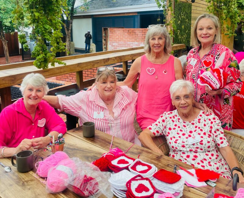 Community crafters gathered at Reflection Pizza Bar to create collaborative blankets in celebration of love, creativity, and giving back.