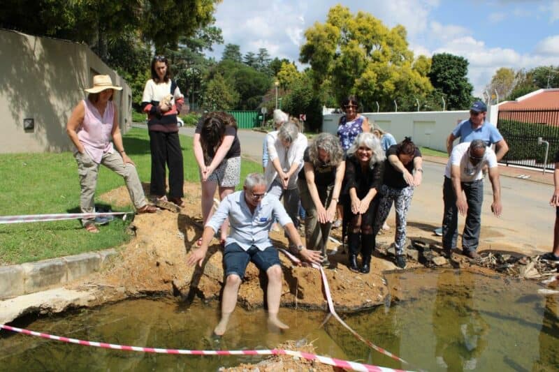 Fed up after more than 3 years of leaks and failed repairs, Balder Road residents hosted a ‘pool party’ meeting around a water-filled excavation, hoping to deliver a message to the city: fix it properly, and fix it now.