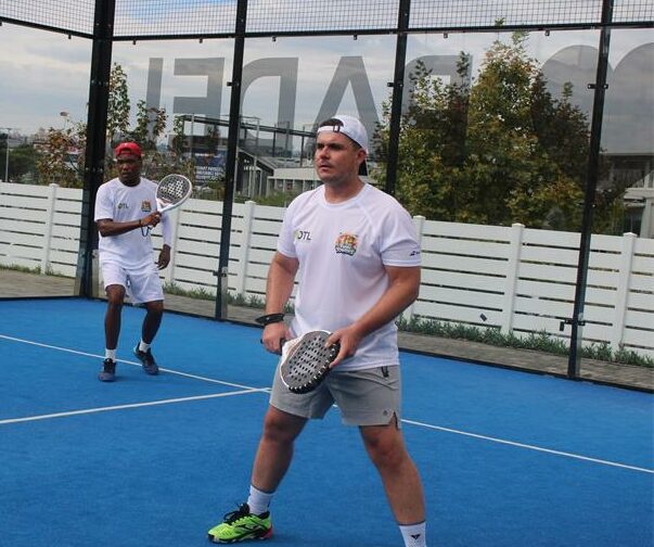A doubles pair in white works together seamlessly, returning shots and maintaining momentum in a spirited Freedom Day clash at Match Padel Cedar on April 27, 2026. Photo: Ayanda Ntshingila