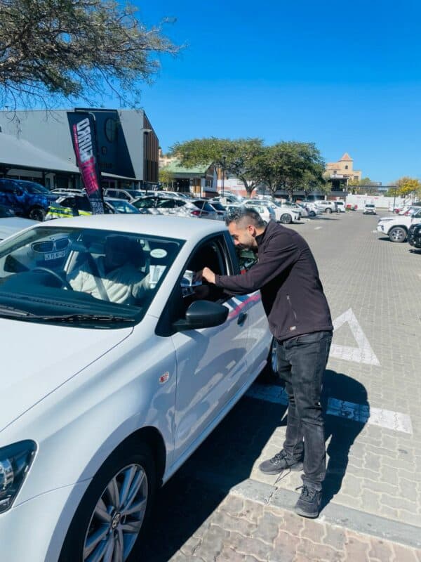 Duran Dixon, from NightGuard Security, interacts with motorists during the crime prevention awareness campaign at Leaping Frog Shopping Centre on May 13, 2026. Photo: Ayanda Ntshingila