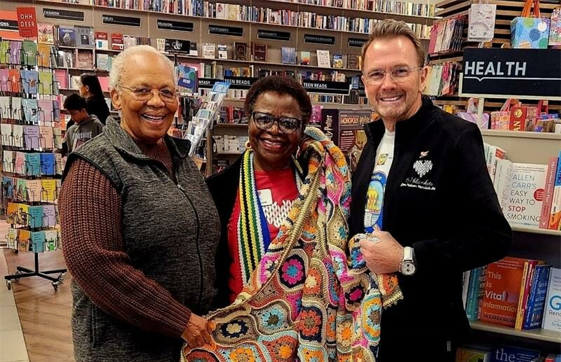 Zona Mzimba, Velly Matsebatlela, and Lynton Lefevre are at the Exclusive Books for the 67 Blankets for Mandela Day initiative. Photo: Supplied