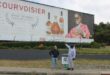 Maj Saffari and Rufas Mazwazi by the large alcohol billboard near the Cedar Road and Riverside Drive intersection opposite Steyn City School on June 4, 2026. Photo: Ayanda Ntshingila